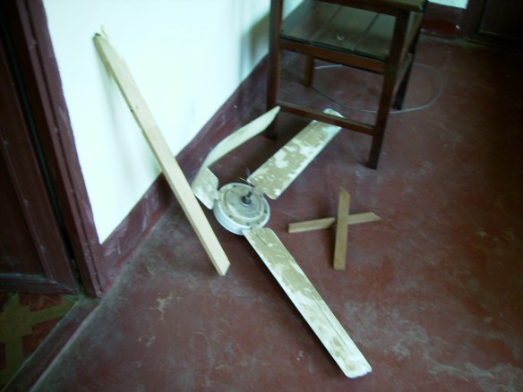 The crumpled remains of my fan, plus some chunks of my bedframe...