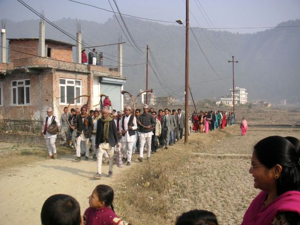 The rest of the wedding party arrives on foot